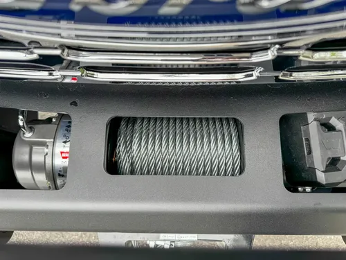 Driver-side interior wide view with steering wheel, dashboard, and center console.